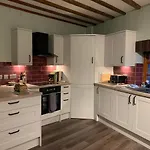 Apartman One, The Carriage House, *