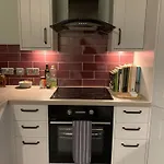 Apartman One, The Carriage House, *
